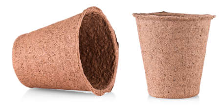 The empty peat pot isolated on whiteの写真素材
