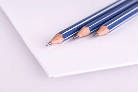 three  pencil on white paper