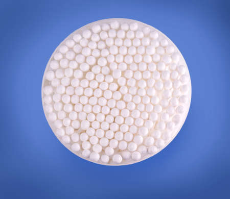 Packing of cotton sticks isolated on blue background