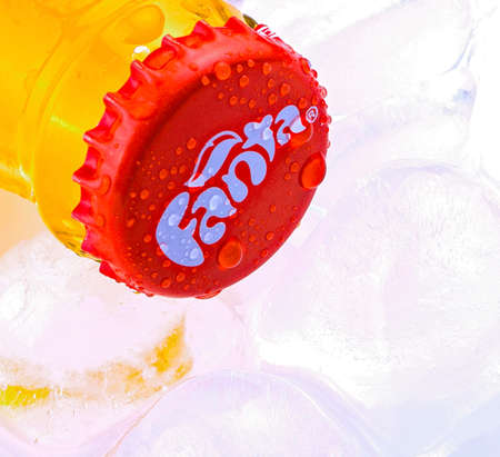 Chisinau, Moldova February 28, 2017: Can of Coca Cola company soft drink Fanta Orange on ice. Fanta is a global brand of fruit-flavored carbonated soft drinks created by The Coca-Cola Company.のeditorial素材