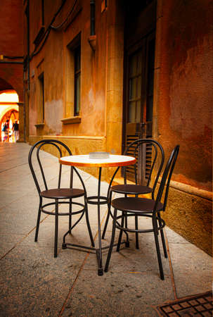 The table and chairs in the street outdoor cafe. Selective focusの写真素材