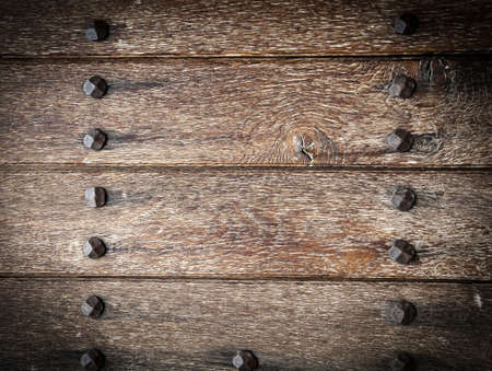 Old boards and metal rivets. Backgrounds and texturesの写真素材