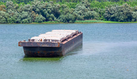 barge transports cargo on the river. Selective focus