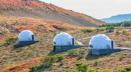 White glamping on the slope of a volcano in autumn on the Kamchatka Peninsulaの写真素材