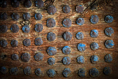 vintage wooden surface with metal rivets. Selective focusの写真素材