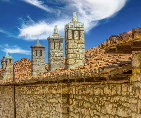 pipes on the old roof against the blue skyの写真素材