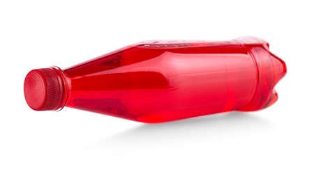 red plastic bottle with juice isolated on white backgroundの写真素材