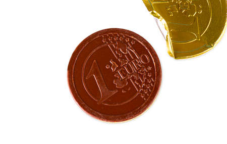 opened Chocolate candy in the form of 1 euro isolated on whiteの写真素材