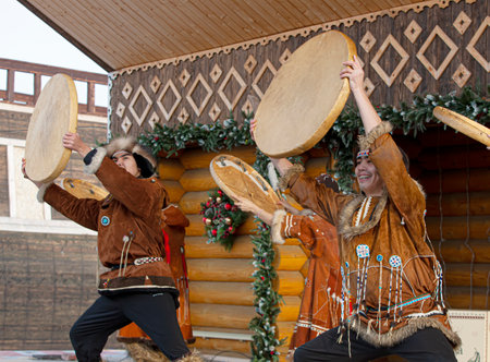 Folk ensemble performance in dress of indigenous people of Kamchatka. The holiday Northern aboriginal Koryakのeditorial素材