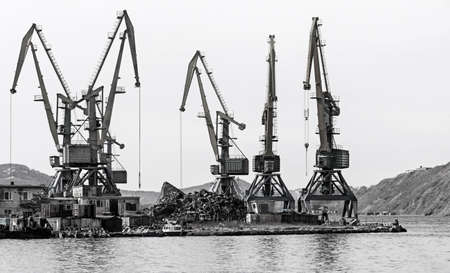 crane at the scrapyard in the seaport in Kamchatka Peninsula