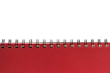 new red notebook with rings isolated on a white backgroundの写真素材