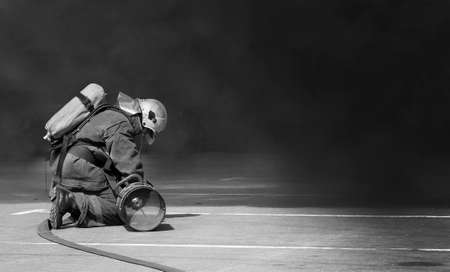 firemen in operation surround with smoke. Selective focus