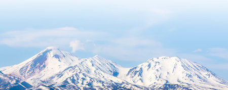 Avachinsky volcano towers over the city of Petropavlovsk-Kamchatsky on the Kamchatka Peninsulaの写真素材