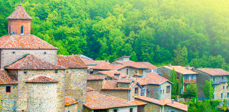 The old buildings with red roofs on soft sunlightの写真素材