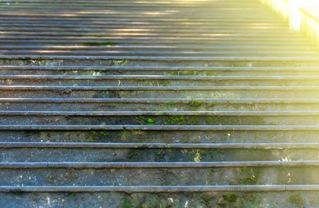 The old stone staircase in soft sunlightの写真素材
