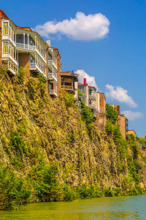 The Houses on the edge of a cliff above the river Kura. Tbilisi, the historic cityの写真素材