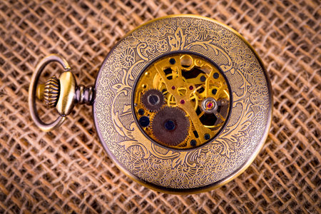 Old vintage clock on burlap backgroundの写真素材