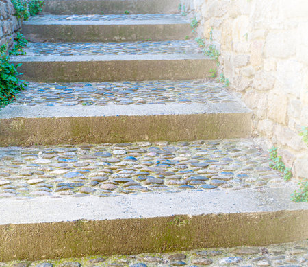 Old stone stairs on soft sunlight. Close up