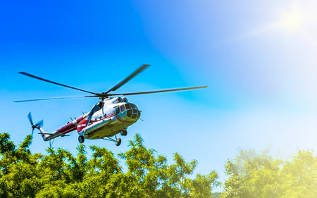 Helicopter in the sky at approach on sunlight