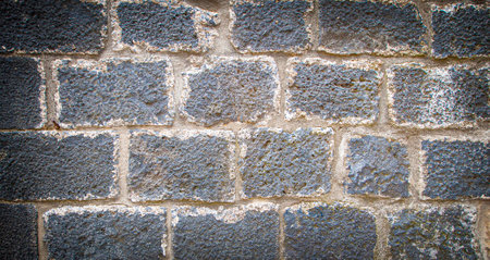 Old wall bricks texture. Selective focus