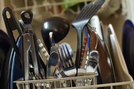 Close Up of Dirty Dishes in Dishwasher ready to be cleanedの写真素材