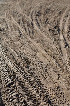 Mountain Bike Tracks in Mud Backgroundの写真素材
