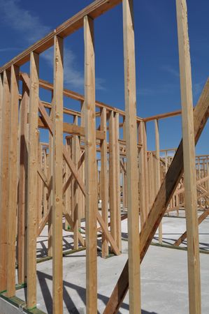 New Home Under Construction with Blue Sky and Foundationの写真素材