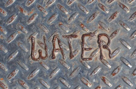 Water Drainage Sign on Diamond Plateの写真素材