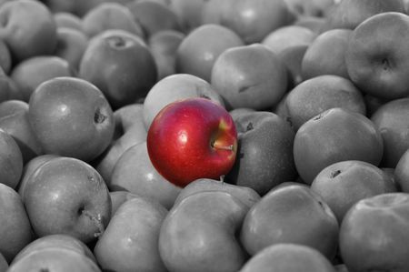 Stand out from the crowd Red Apple in the middle of Black and White Average Groupの写真素材