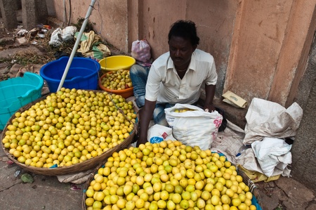 BANGALORE, IN - JUNE 26: Vendor sells limes on an unnamed street in Bangalore, IN June 26, 2011 in...