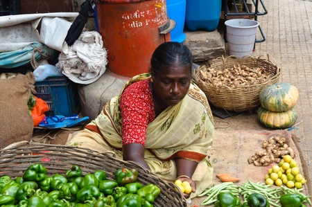 BANGALORE, IN - JUNE 26: Vendor sells produce on an unnamed street in Bangalore, IN June 26, 2011 in Bangalore, India. 42% of India falls below the international poverty line of $1.25 a day.のeditorial素材