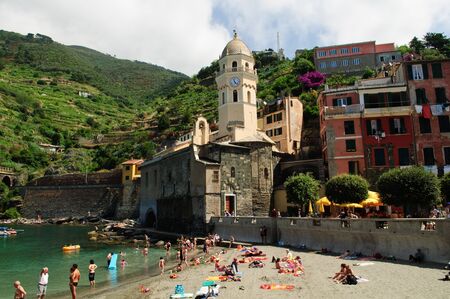 VERNAZZA, ITALY - JUNE 121: Tourists play on the beach on June 121 2011 at Vernazza. Vernazza is  part of Cinque Terre. Cinque Terre is a UNESCO World Heritage Site.のeditorial素材