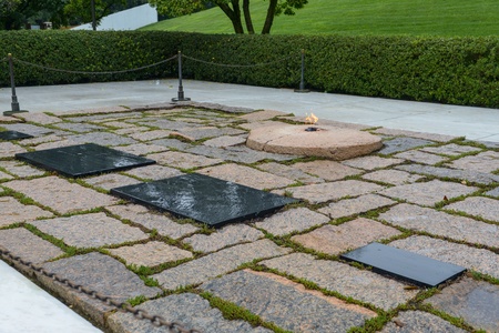 WASHINGTON DC - AUGUST 19: Gravestone of JFK on Arlington National Cemetery August 19, 2012 in Washington DC, USA. The Kennedy gravesite is one of the most visited memorials at Arlington National Cemeteryのeditorial素材