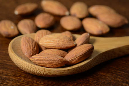 Almonds in a Spoon Close Upの写真素材