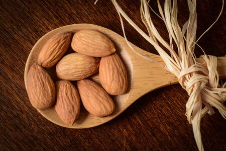 Almonds on Wooden Spoonの写真素材