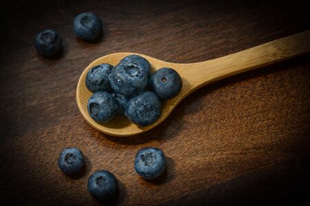 Blueberries on a Wooden Spoonの写真素材