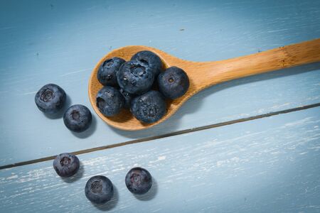 Blueberries on a Wooden Spoonの写真素材