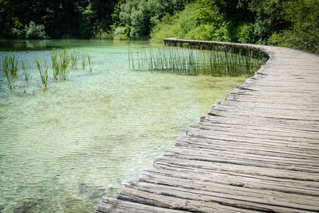 Wooden Boardwalk  for Hiking next to a Lakeの写真素材