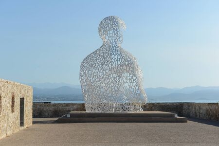 ANTIBES - JULY 15: The Nomade sculpture in the port of Antibes, on July 15, 2012 in France. The sculpture is by Jaume Plensa and uses light, sound, and language to express its message.のeditorial素材