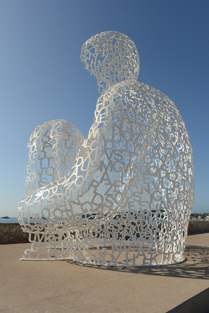 ANTIBES, FRANCE - JULY 15: The Nomade sculpture in the port of Antibe on July 15, 2012. The sculpture is by Jaume Plensa and uses light, sound, and language to express its message.のeditorial素材