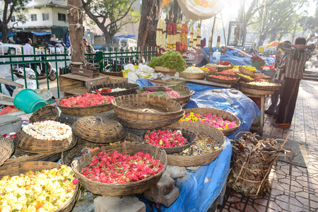 BANGALORE, IN - JANUARY 09: Vendor sells flowers on the street in Bangalore, IN January 09, 2013 in Bangalore, India. 42% of India falls below the international poverty line of $1.25 a day.のeditorial素材