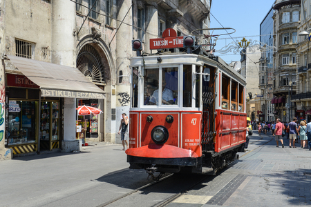 ISTANBUL, TURKEY - JULY 09: Old-fashioned red tram at the street Istanbul on July 09, 2014. Nostalgic tram is the heritage tramway system. It was re-established in 1990 and gained much popularity.のeditorial素材
