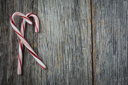 Candy Cane on Rustic Wood Backgroundの写真素材