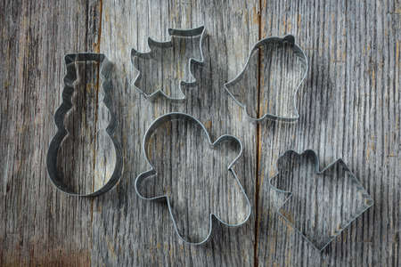 Holiday Cookie Cutters on Rustic Wood Backgroundの写真素材
