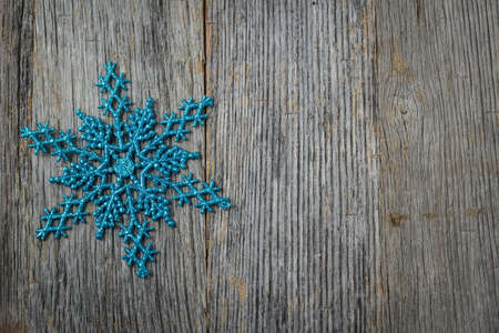 Snowflake Decoration on Wooden Backgroundの写真素材