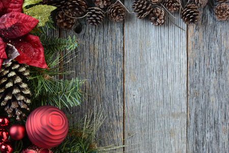 Christmas Decorations with Pine Cones and Rustic Wood Backgroundの写真素材