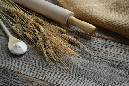 Rolling Pin with Wheat and Spoon with Flourの写真素材
