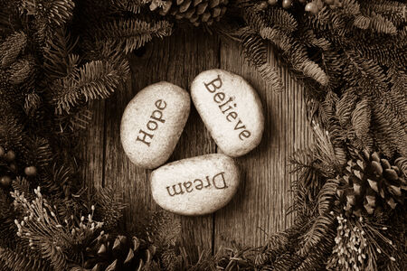 Hope, Dream, Believe in Text in the center of a Christmas Wreathの写真素材