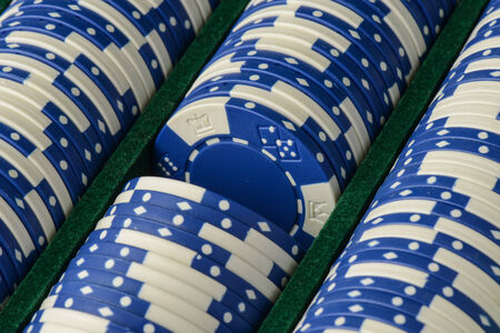 Blue Poker Chips in a Rowの写真素材