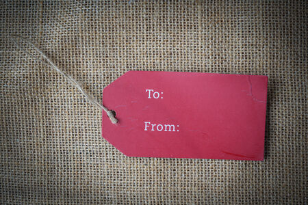 Gift Tag on Burlap Backgroundの写真素材